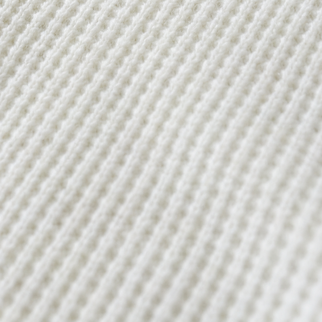 White waffle-knit fabric supporting detail, hardware excluded