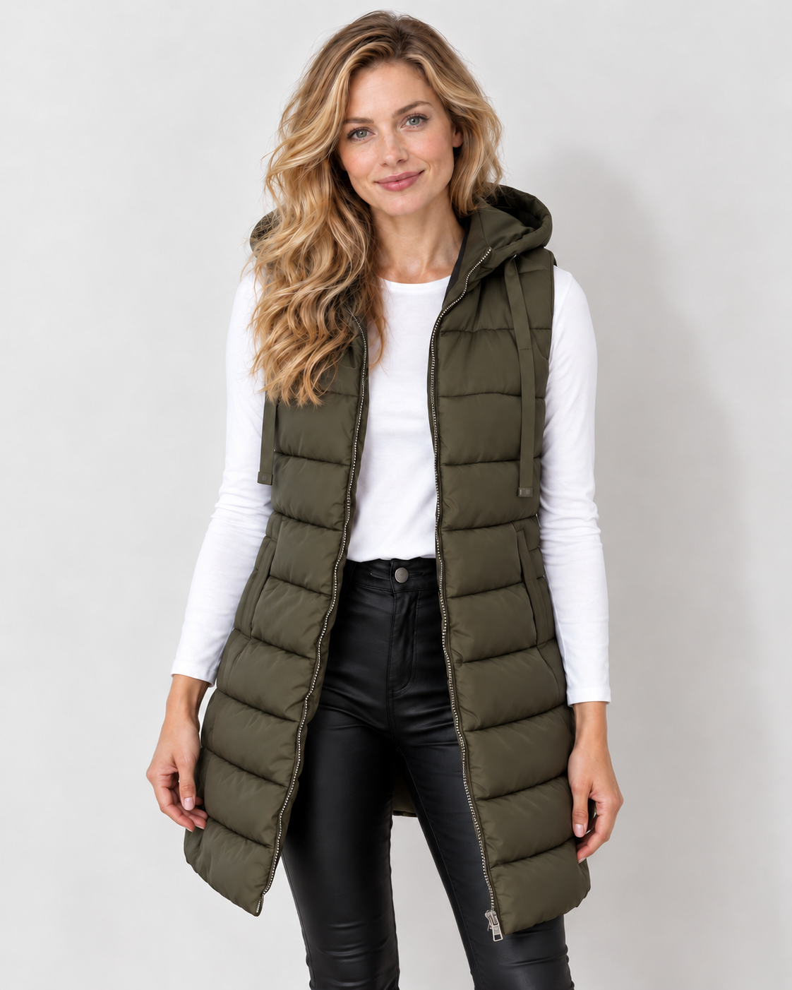 Avery & Mercer women's longline hooded puffer vest in Dark Green, front view on own model W01