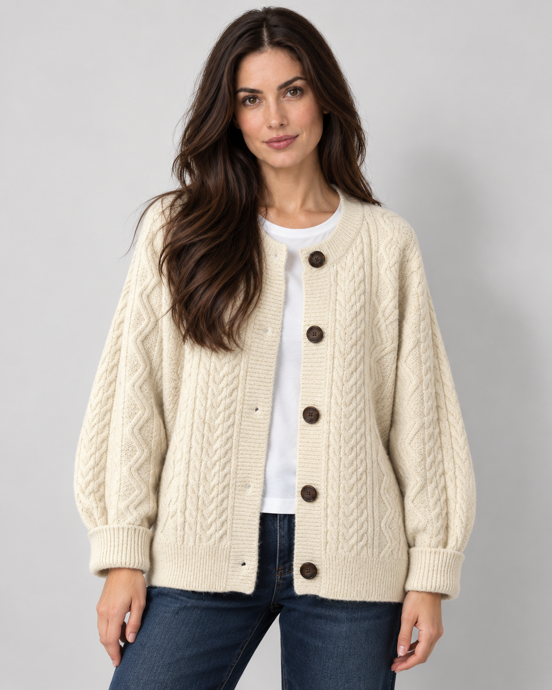 Women's oversized cable knit button-down cardigan, beige view on Avery & Mercer model