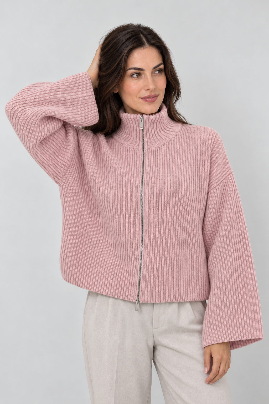 Women's pink oversized ribbed full-zip knit cardigan, front view on Avery & Mercer model