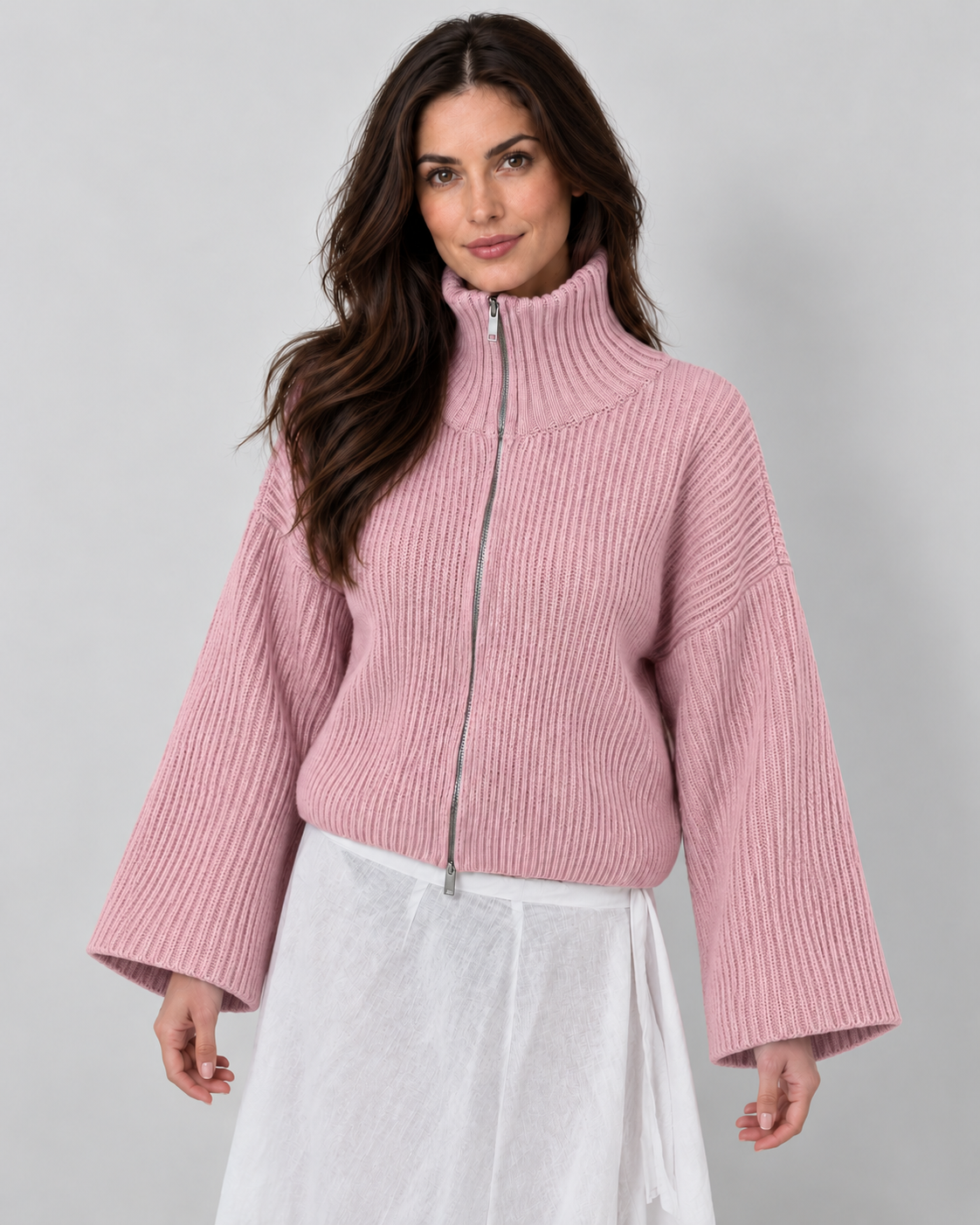 Women's pink oversized ribbed full-zip knit cardigan, hero view on Avery & Mercer model