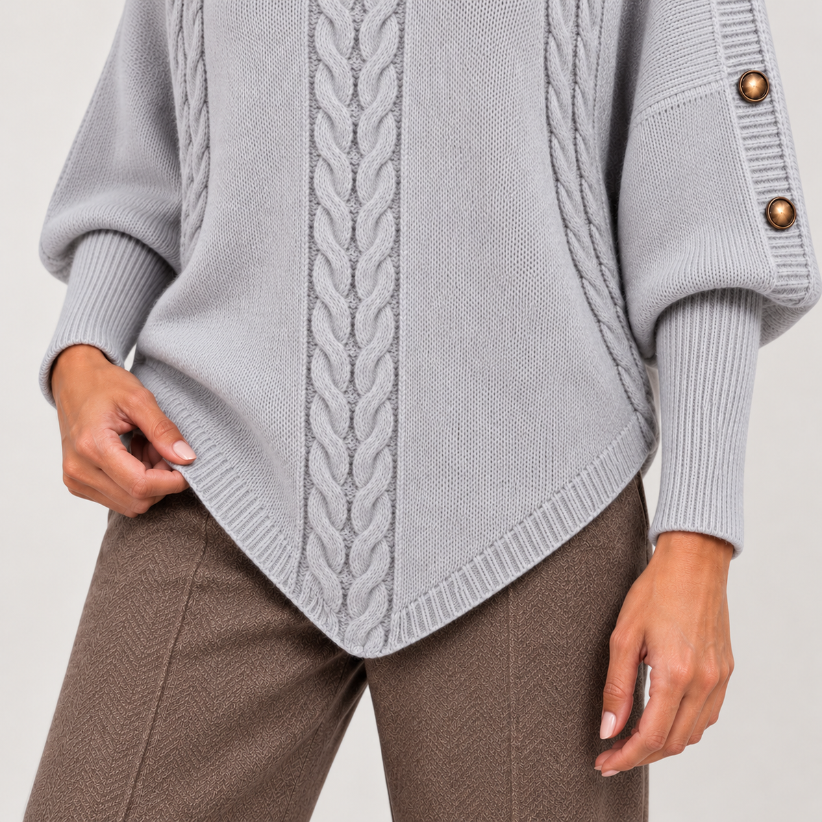Cable-knit turtleneck sweater with shoulder buttons, grey lower detail