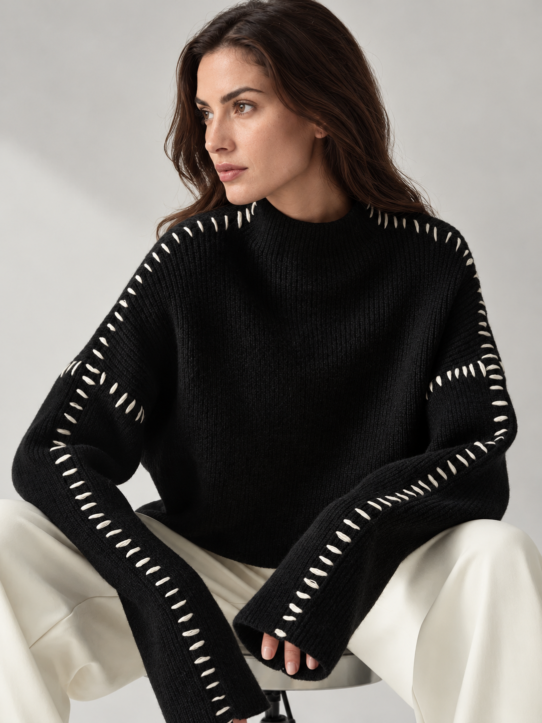 Women's contrast-stitch ribbed sweater - black seated