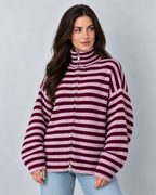 Women's oversized burgundy and pink striped zip-up knit sweater cardigan, shallow front-angle view on Avery model W02 in neutral studio