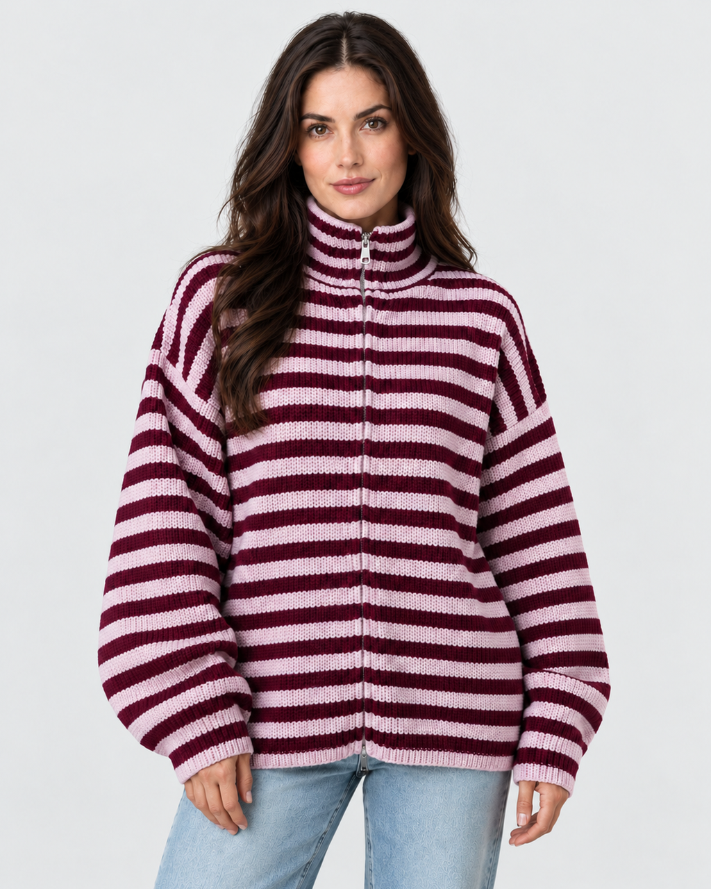 Women's oversized burgundy and pink striped zip-up knit sweater cardigan, front view on Avery model W02 in neutral studio