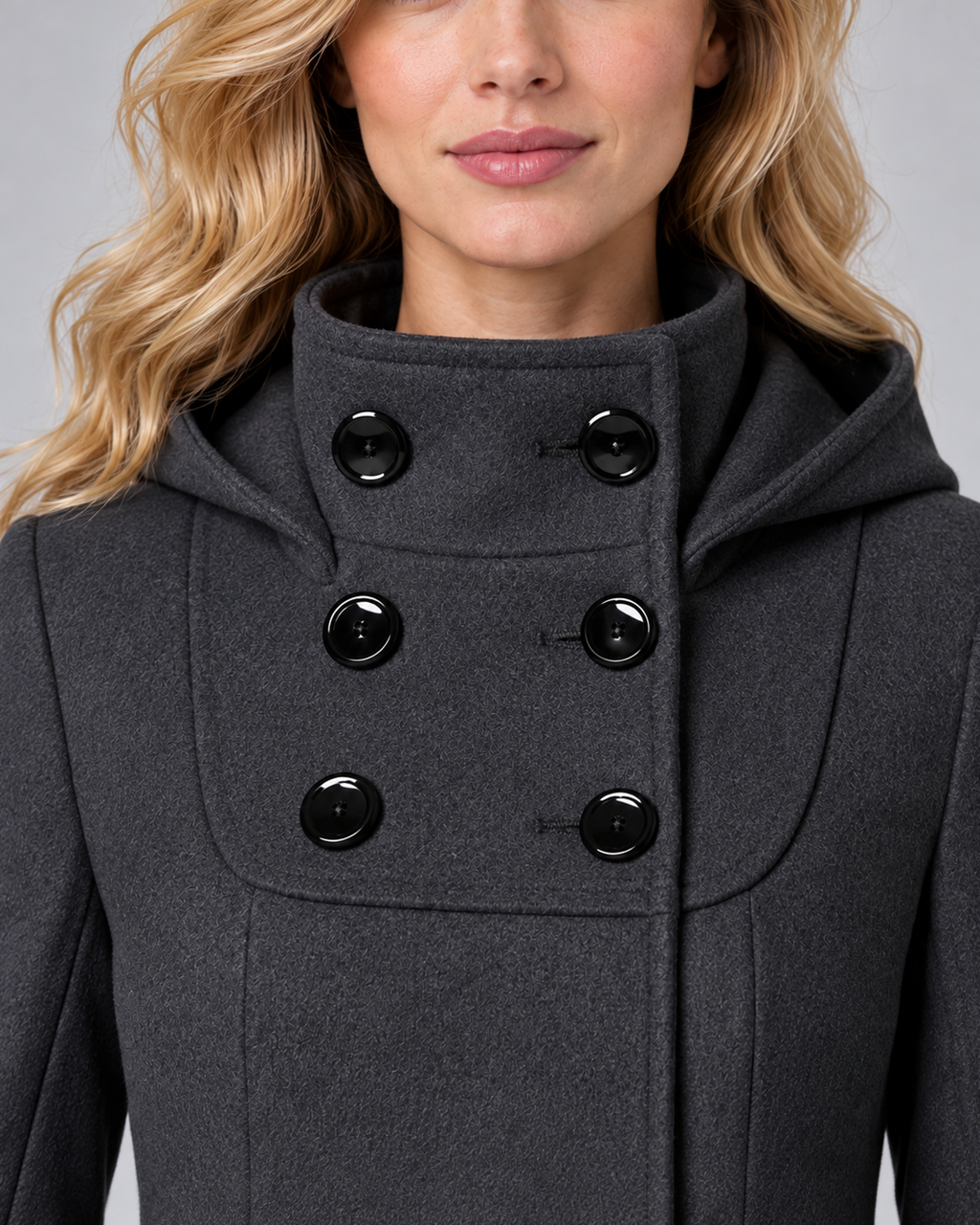 Women's hooded high-neck A-line coat in dark grey, collar and six-button construction detail, on the approved studio model