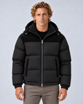 Men's hooded quilted puffer jacket in black, front hero, photographed on the approved studio model