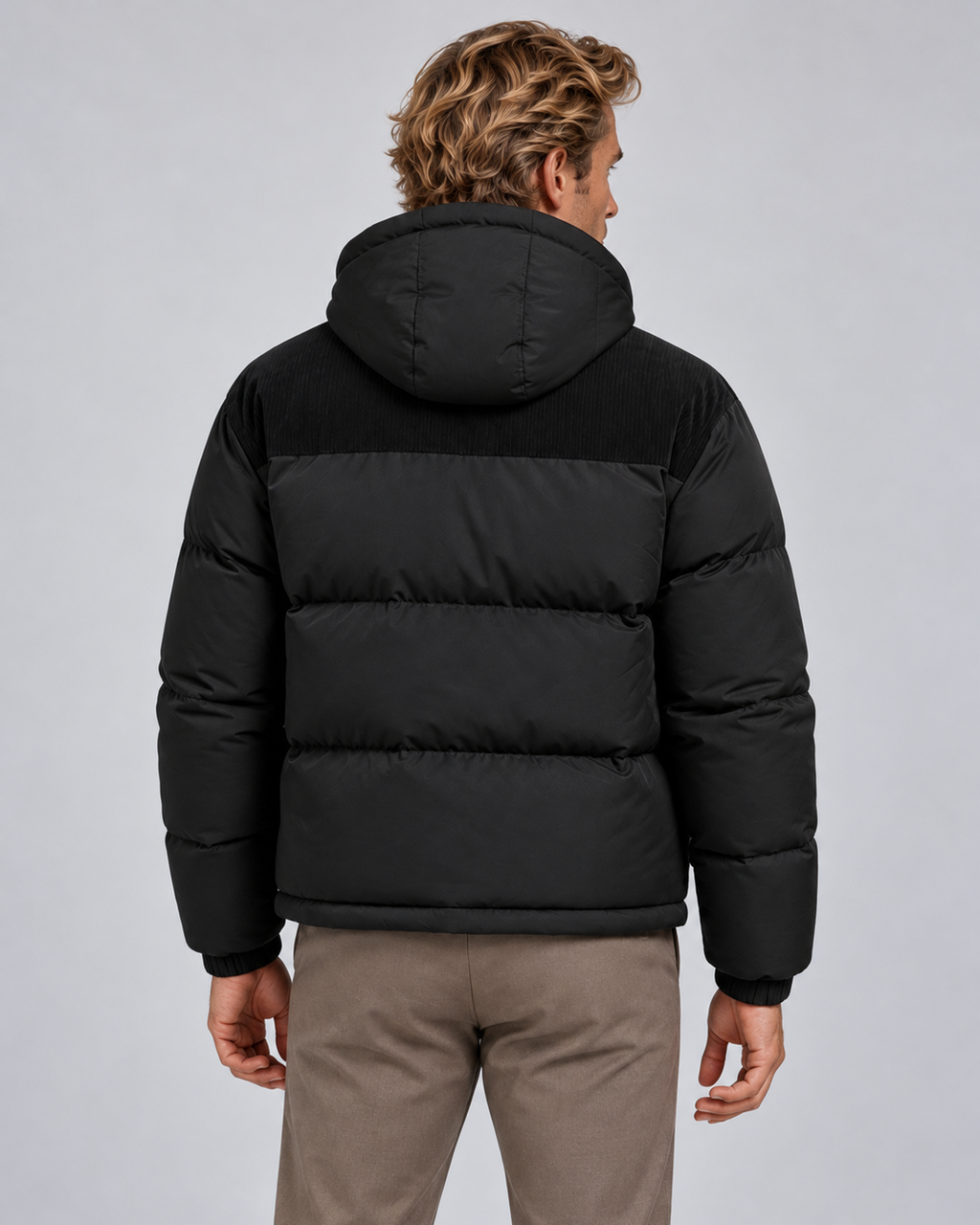 Men's hooded quilted puffer jacket in black, rear, photographed on the approved studio model