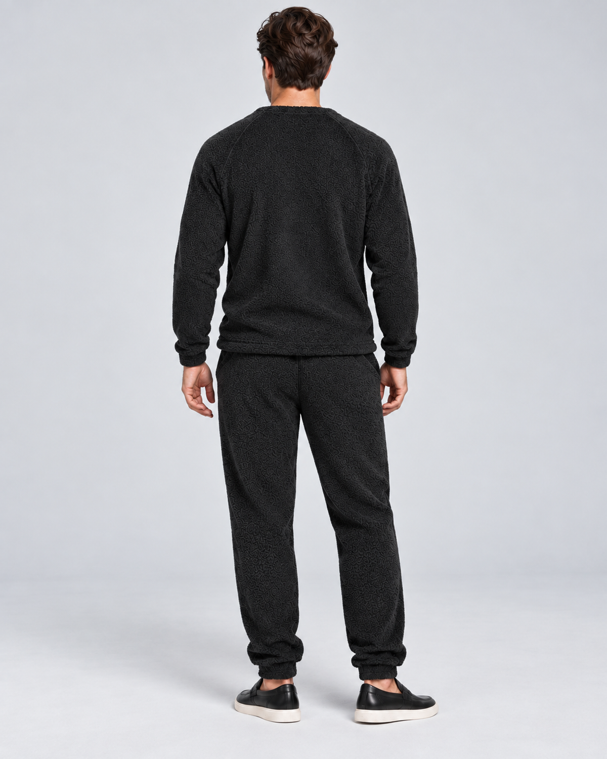 Men's plush fleece jumper and jogger set in black, rear full-length