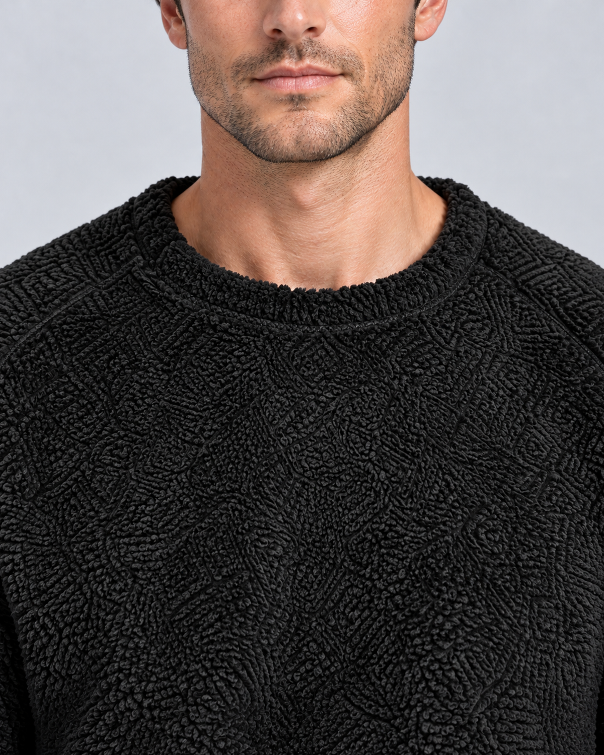 Men's plush fleece jumper and jogger set in black, neckline and plush texture detail