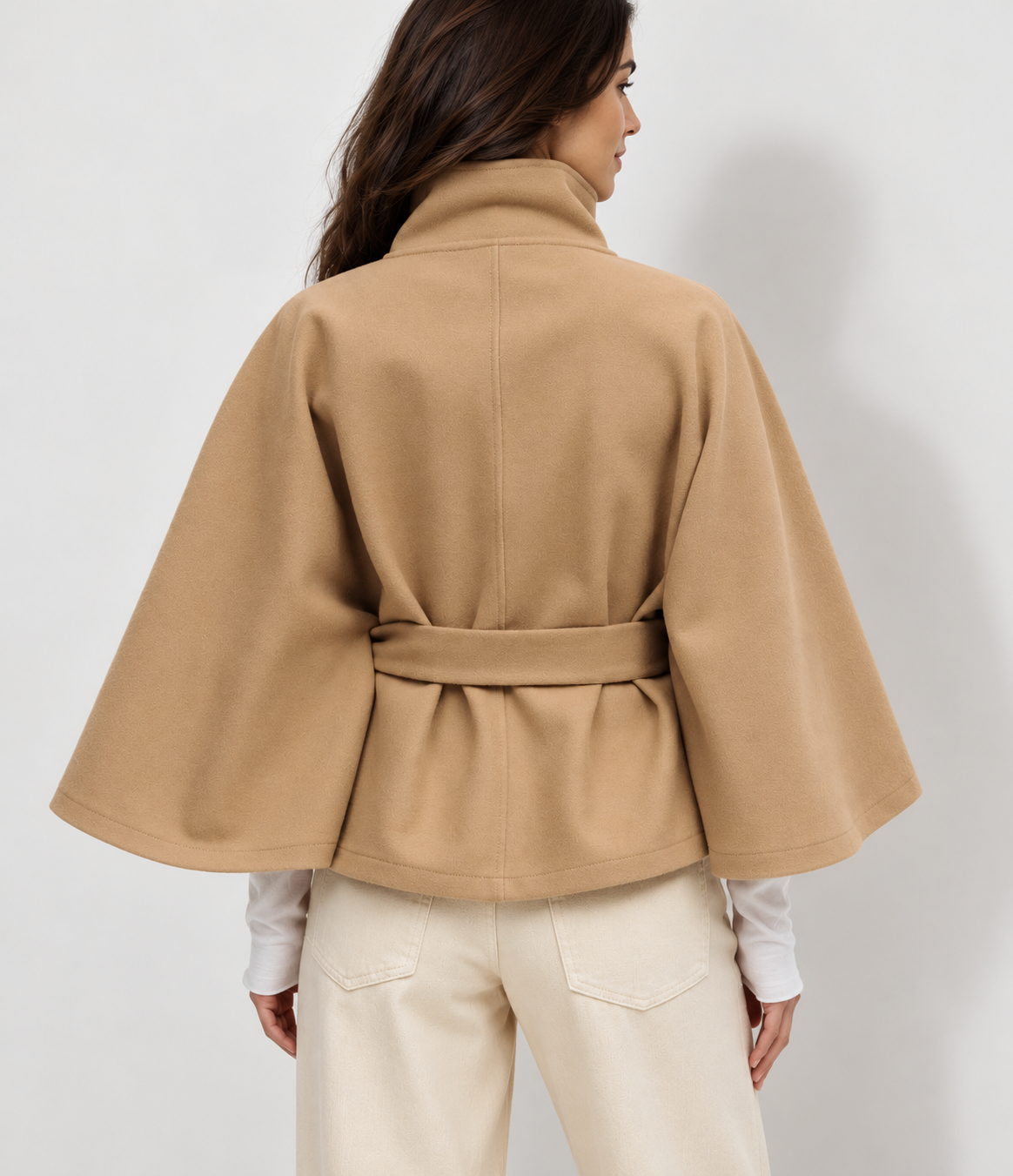 Avery & Mercer model wearing khaki belted cape jacket, back view