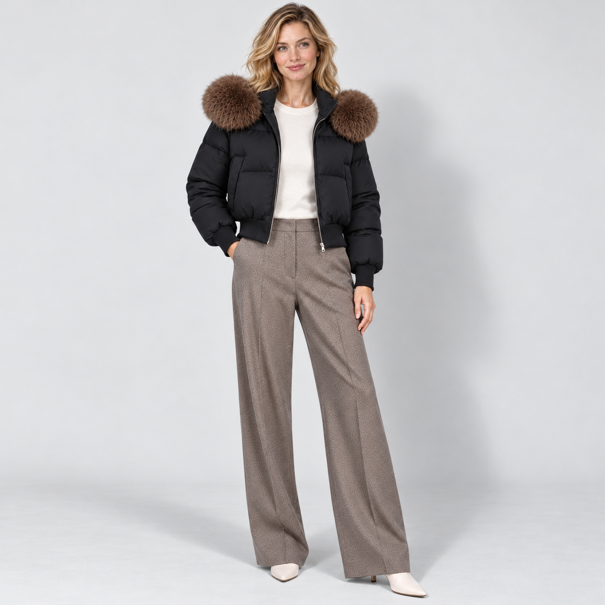 Women's cropped puffer jacket in black, full view on Avery Mercer model W01