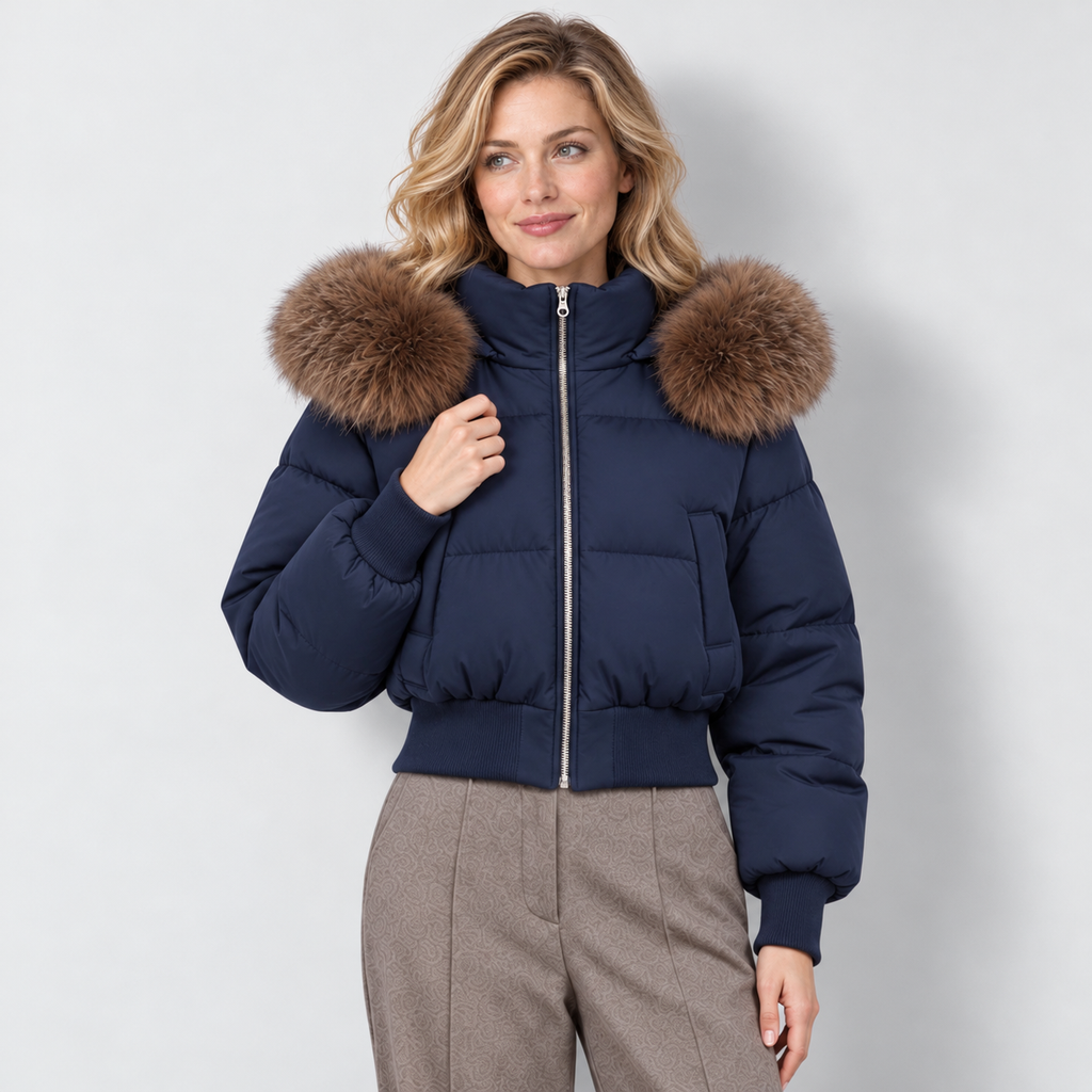 Women's cropped puffer jacket in navy, front view on Avery Mercer model W01
