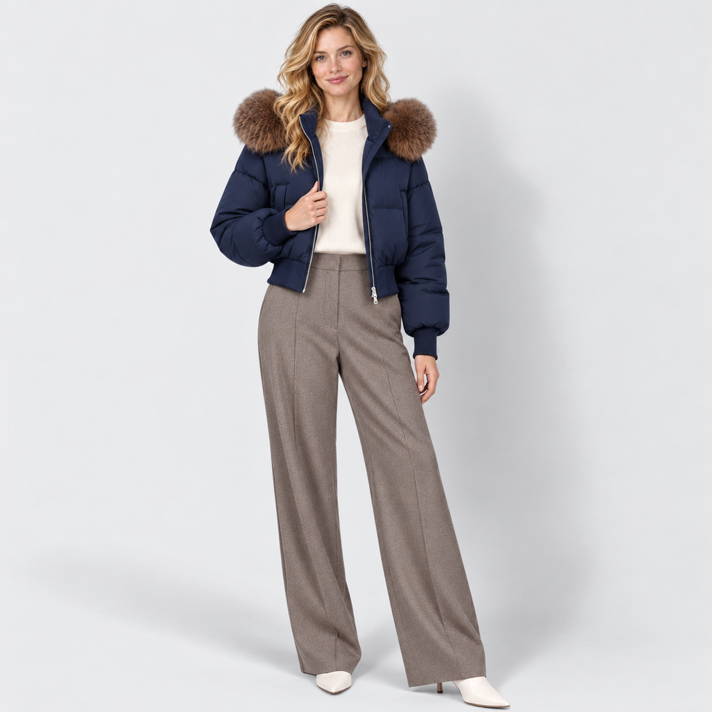Women's cropped puffer jacket in navy, full view on Avery Mercer model W01