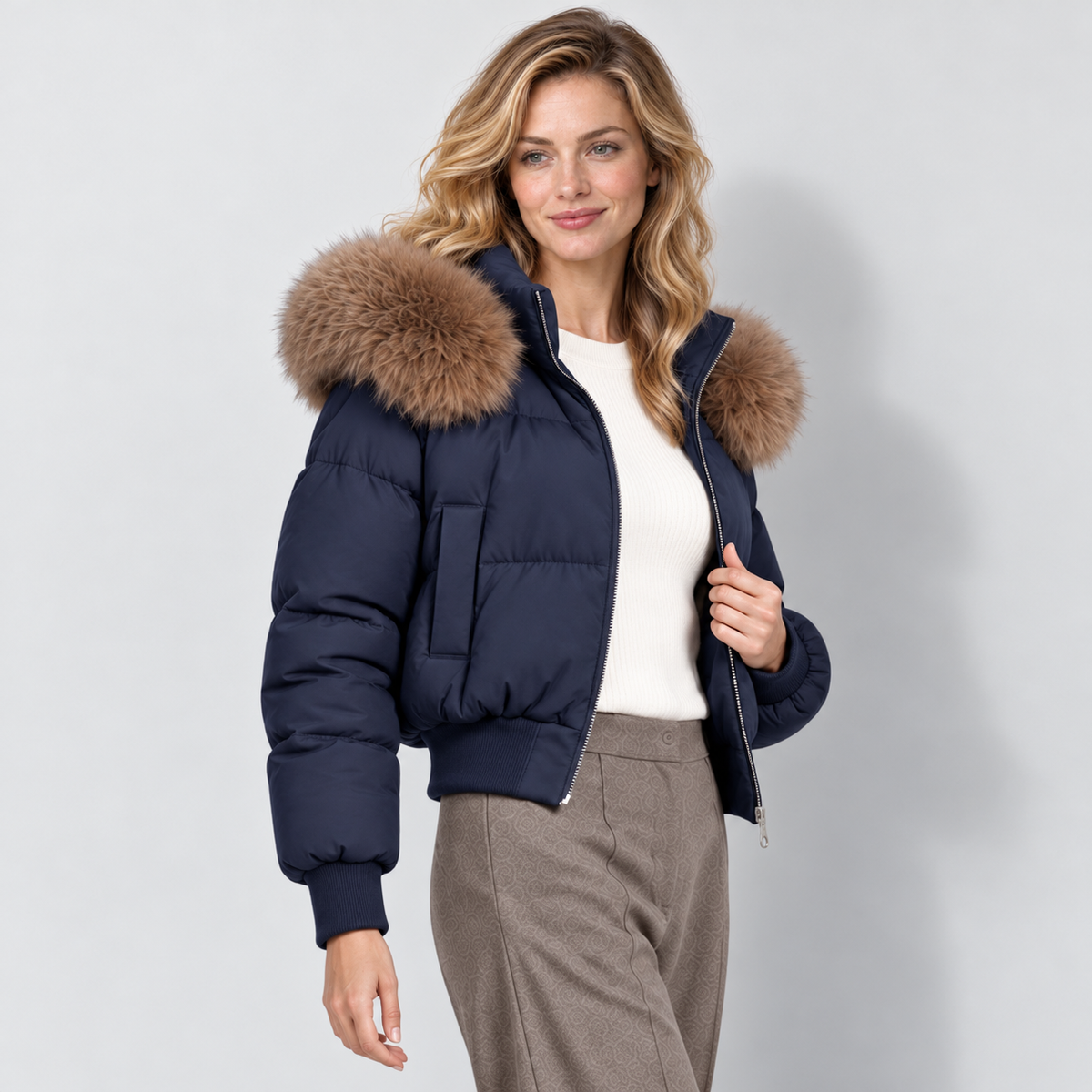 Women's cropped puffer jacket in navy, open view on Avery Mercer model W01