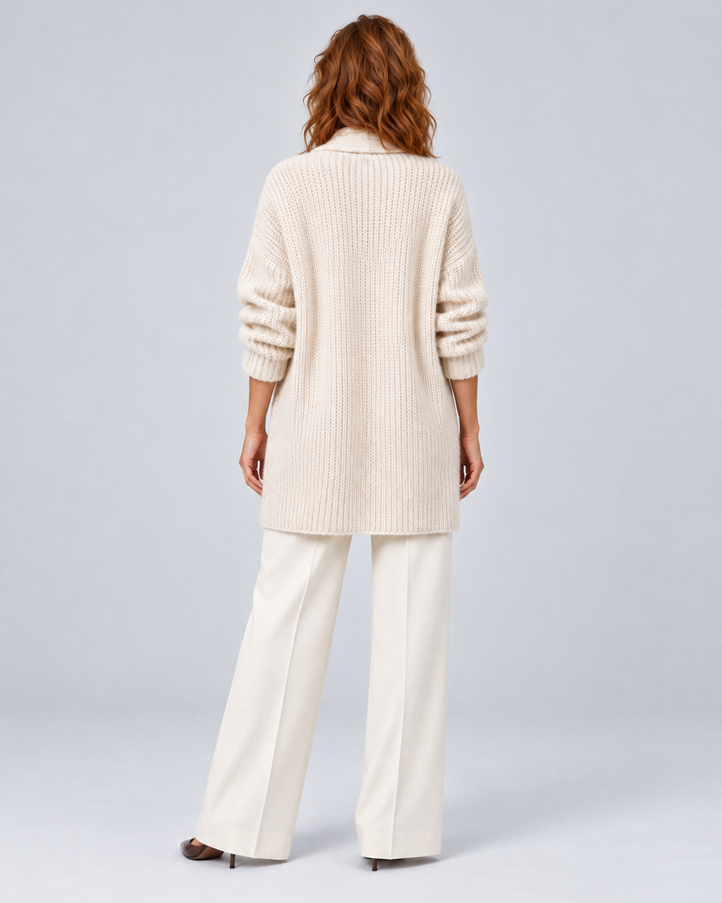 Women's longline open-front knit cardigan in beige, rear full-length, on approved studio model
