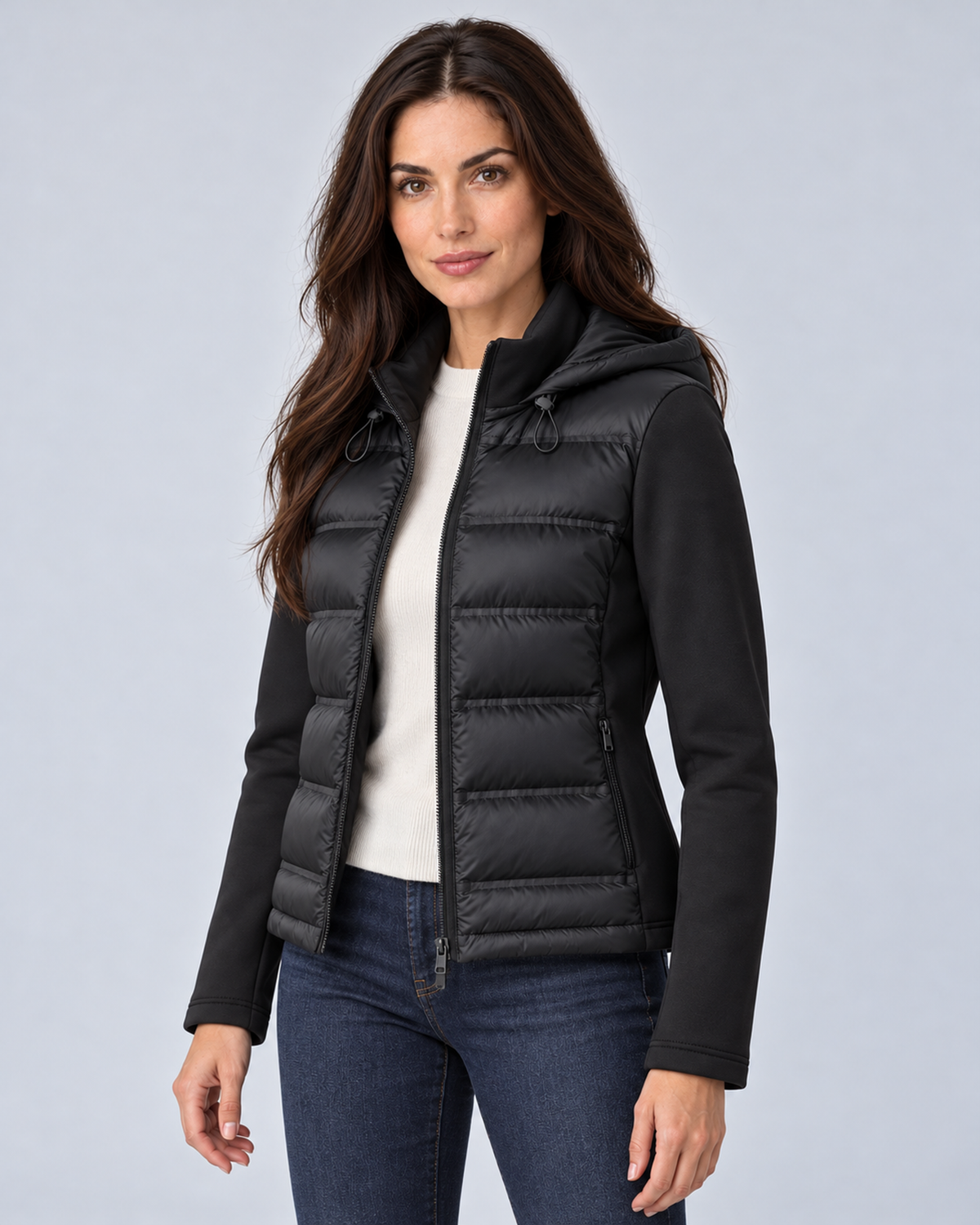 Black women's hooded puffer jacket, three quarter open, grey studio