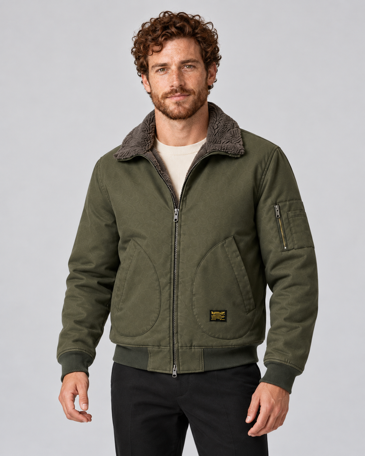 Men’s sherpa-lined zip jacket in army green, front hero, photographed against a light grey studio background