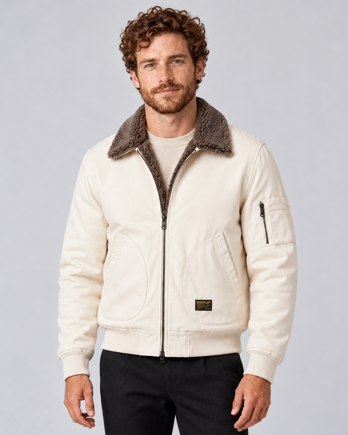 Men’s sherpa-lined zip jacket in white, front hero, photographed against a light grey studio background