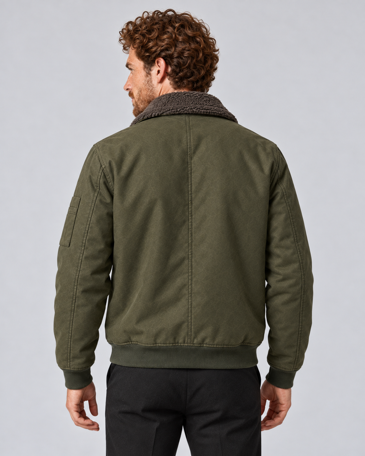 Men’s sherpa-lined zip jacket in army green, rear view, photographed against a light grey studio background