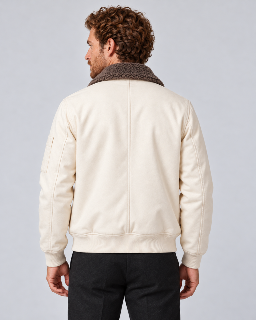 Men’s sherpa-lined zip jacket in white, rear view, photographed against a light grey studio background