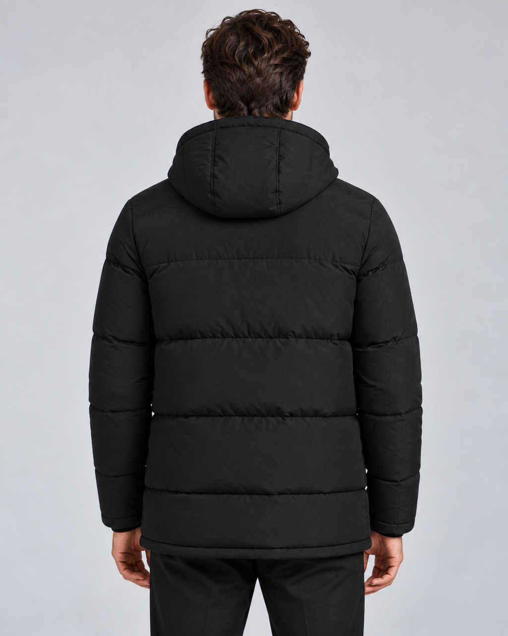 Men's hooded puffer jacket in black, rear view, on approved studio model