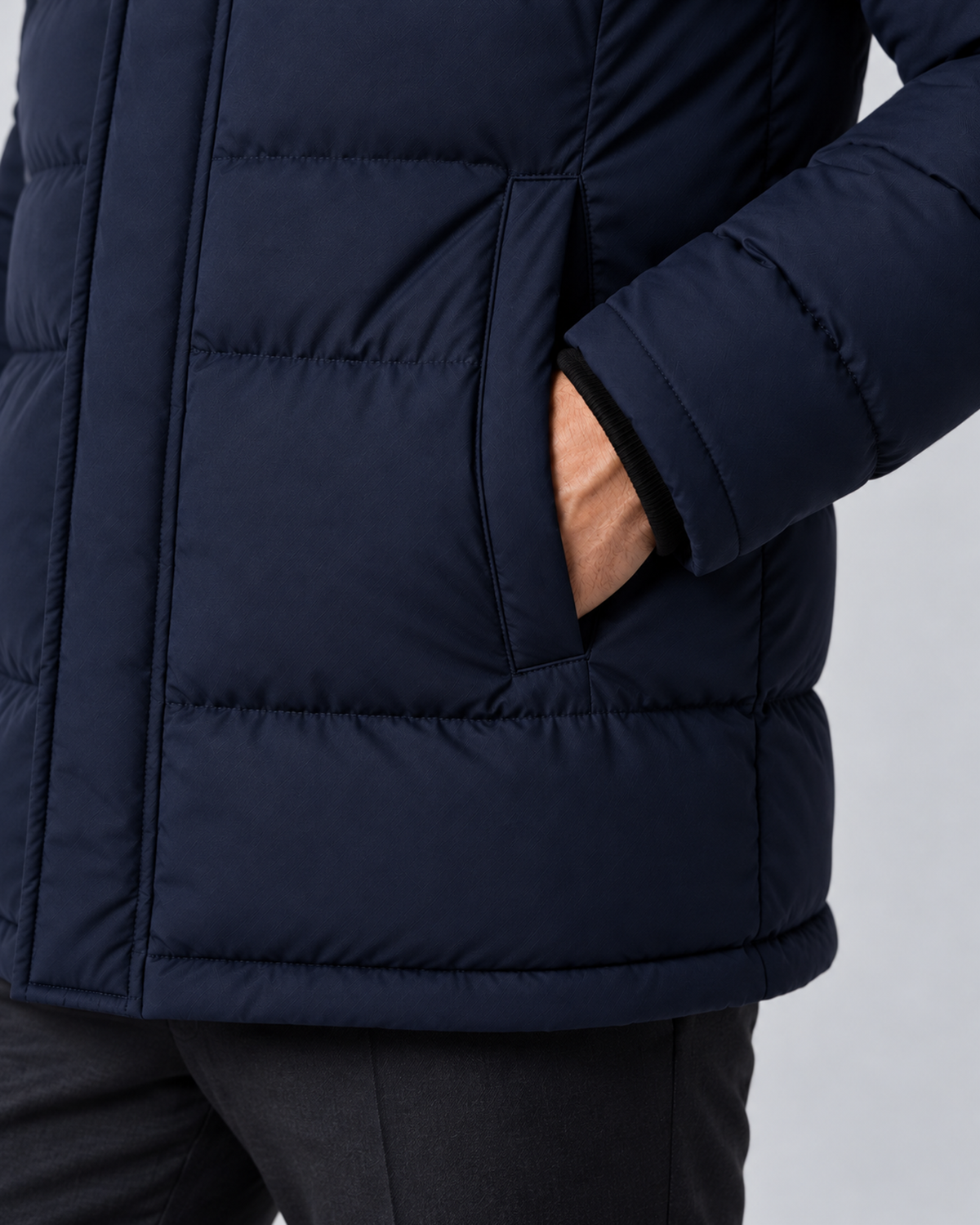 Men's hooded puffer jacket in navy, pocket and cuff detail, on approved studio model