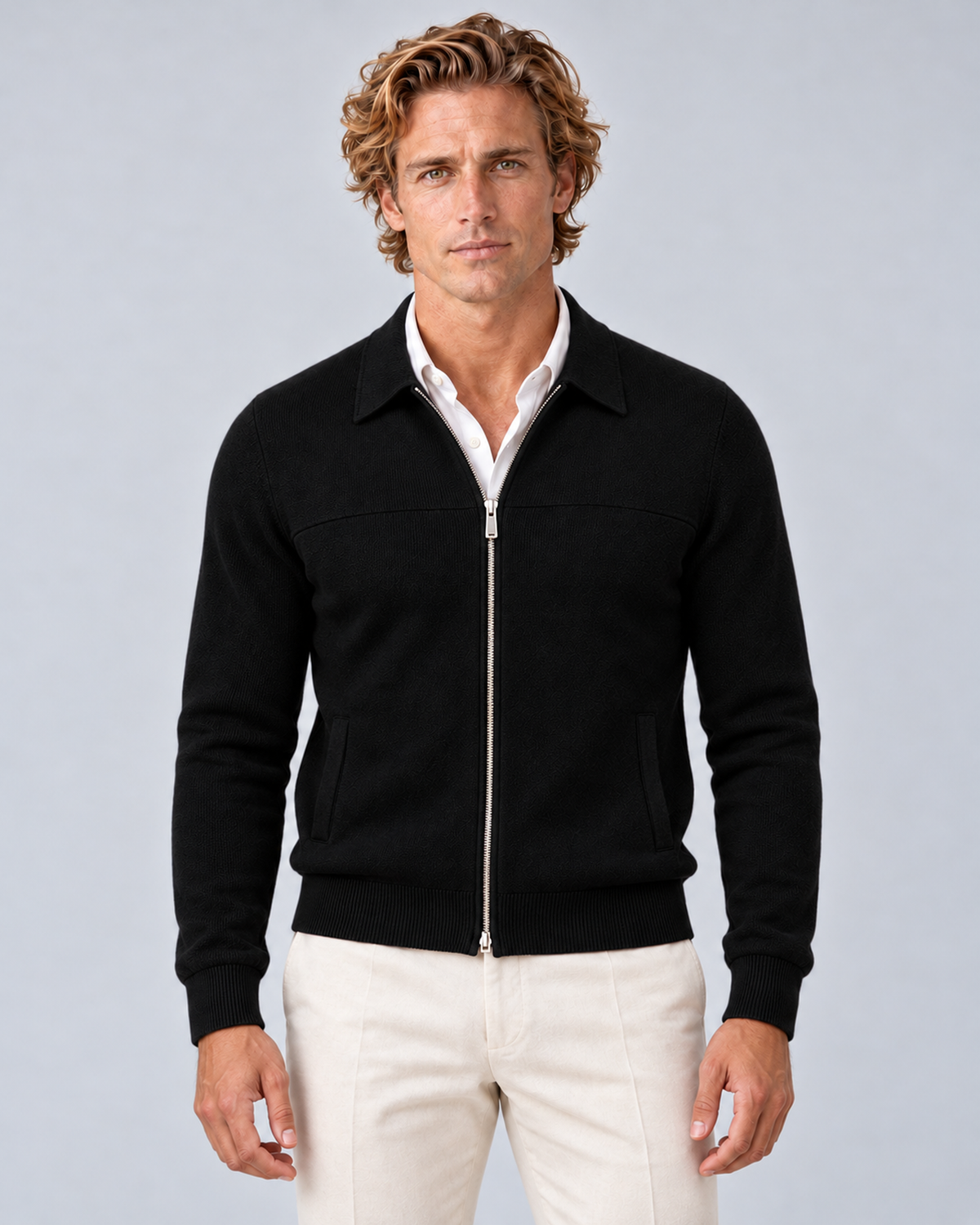 Men's full-zip collared knit jumper in black, front hero, photographed in a grey studio