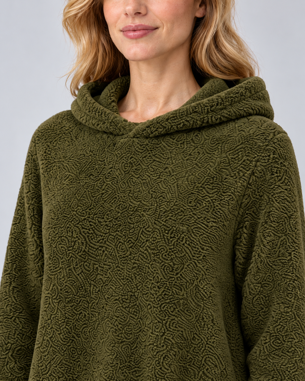 Women's plush hooded tunic in army green, hood and texture detail, photographed in a grey studio