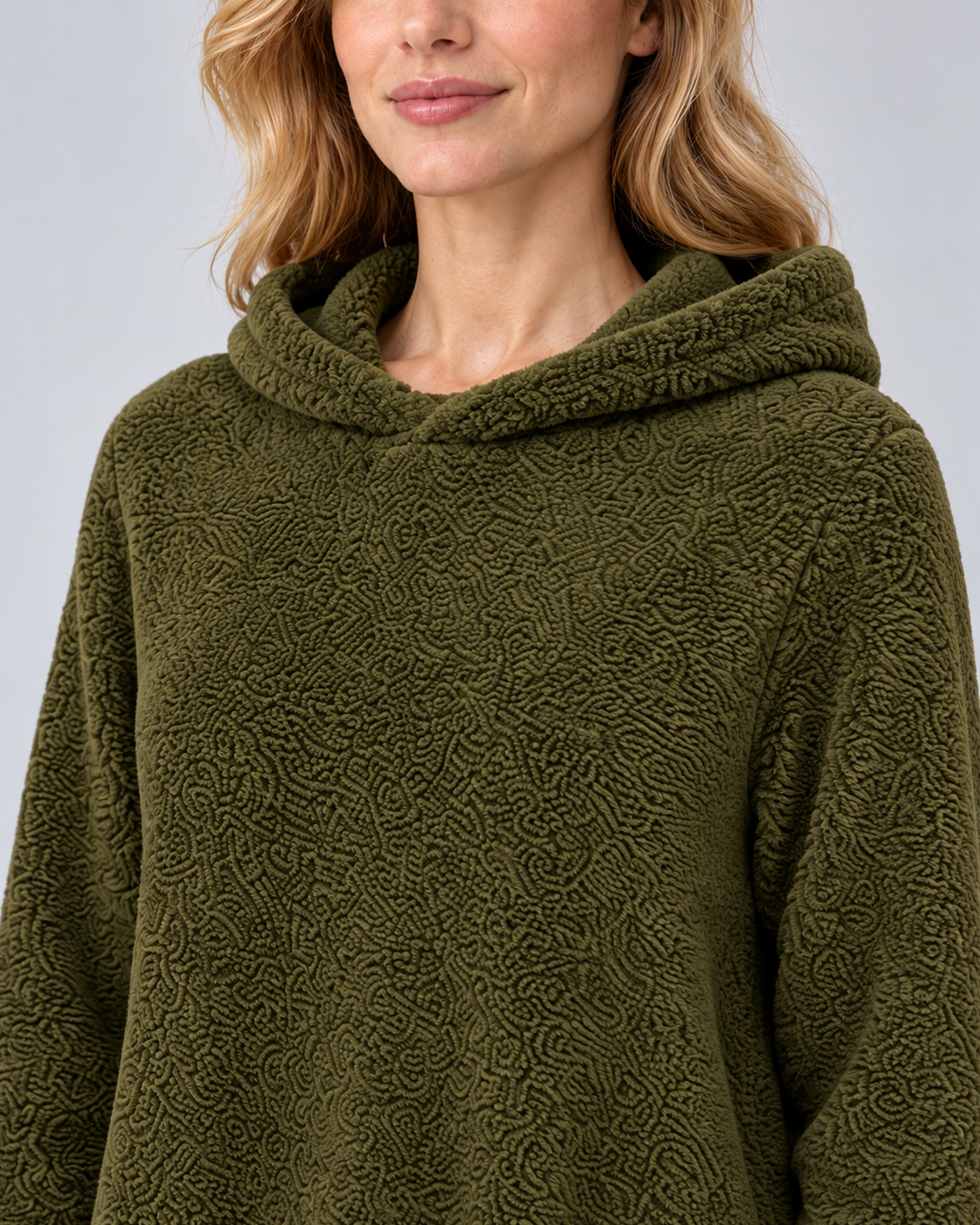Women's plush hooded tunic in army green, hood and texture detail, photographed in a grey studio