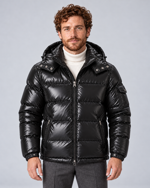 Men's glossy black puffer jacket with removable hood, front hero, on a light grey studio background