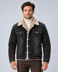 Men’s sherpa-lined denim trucker jacket in black, front hero, on studio model
