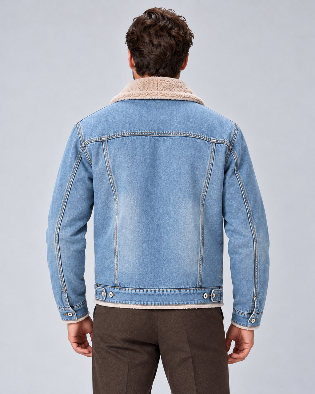 Men’s sherpa-lined denim trucker jacket in light blue, rear view, on studio model