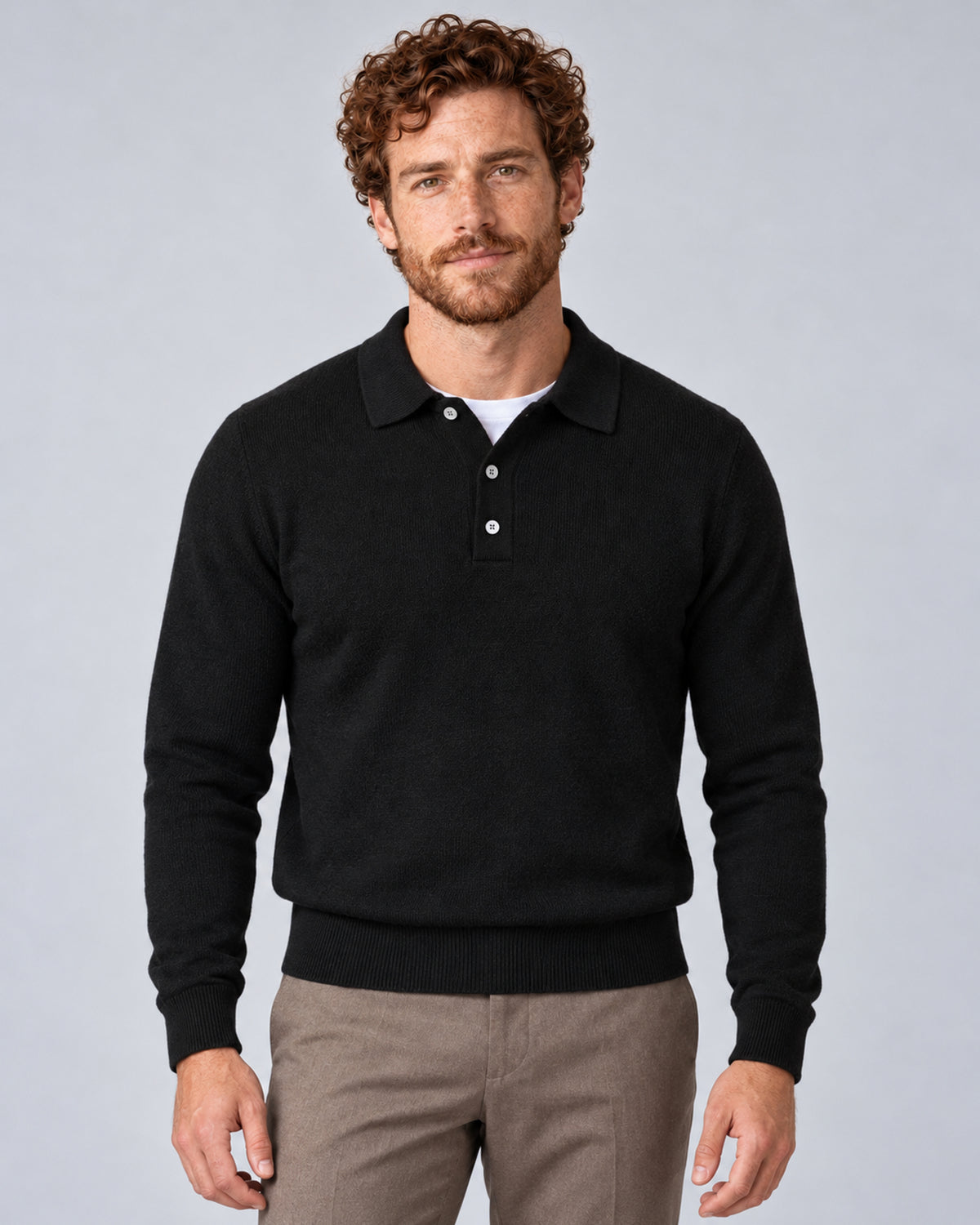 Men’s black textured long-sleeve polo sweater, front view on model.