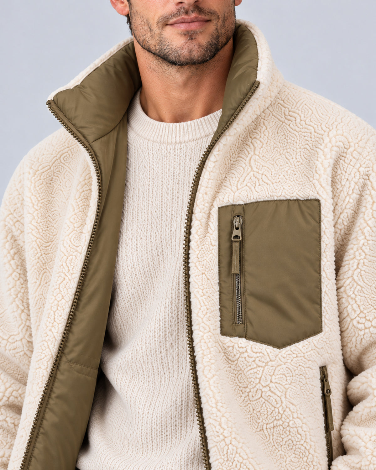 Olive Green reversible jacket, close-up of sherpa texture, stand collar and zip chest pocket