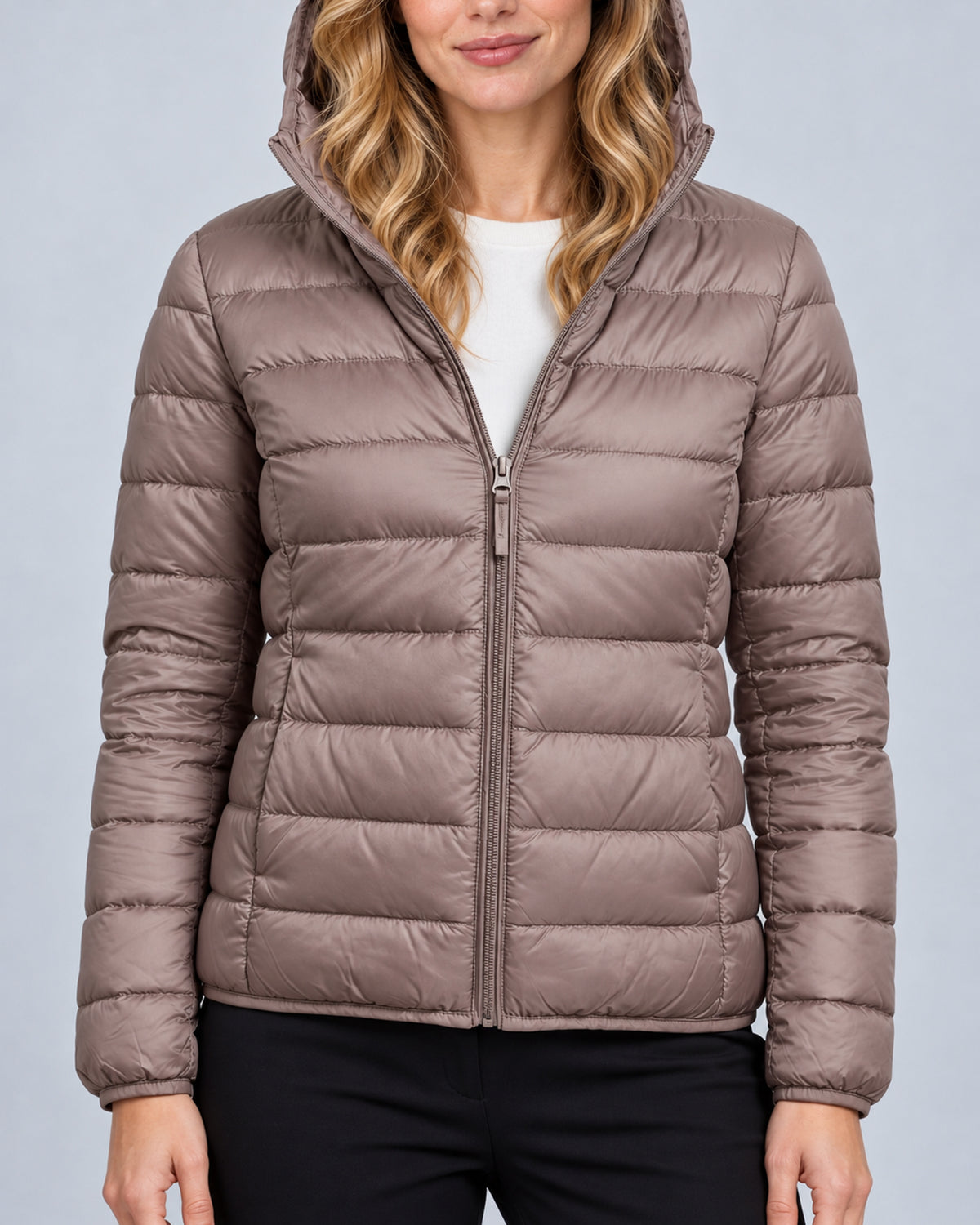 Champagne women's hooded quilted puffer jacket, close view of front zipper, quilting and cuffs