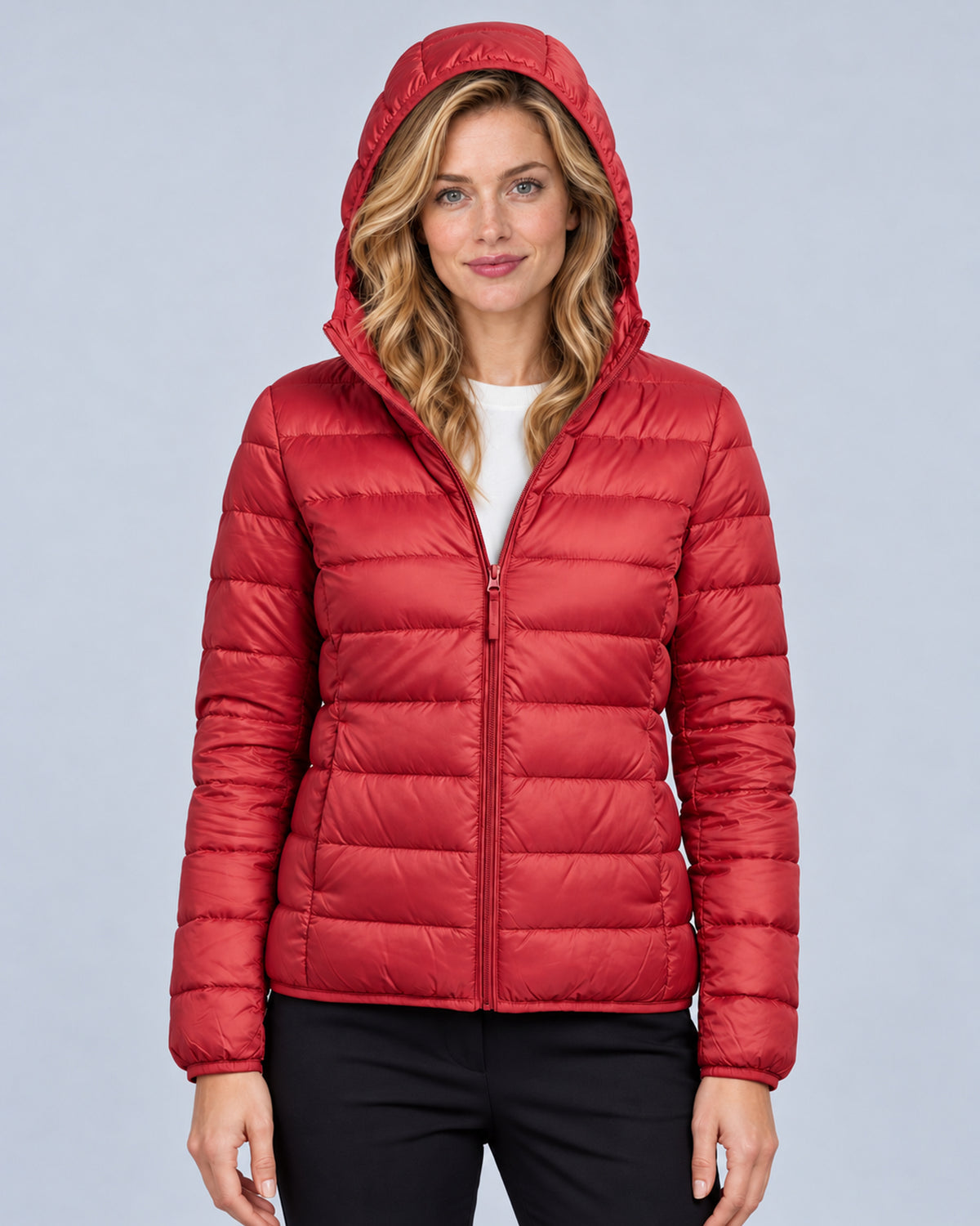 Red women's hooded quilted puffer jacket, front view with hood up