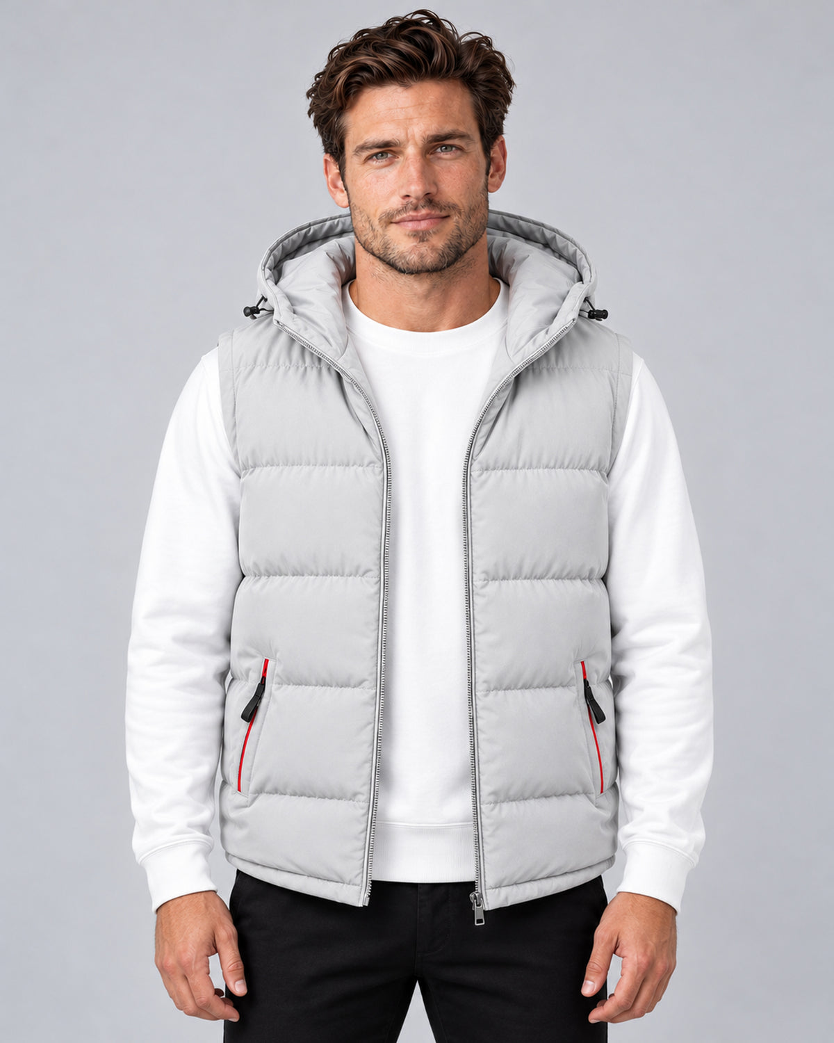 Men's light grey hooded padded gilet with horizontal quilting, front view on a model.