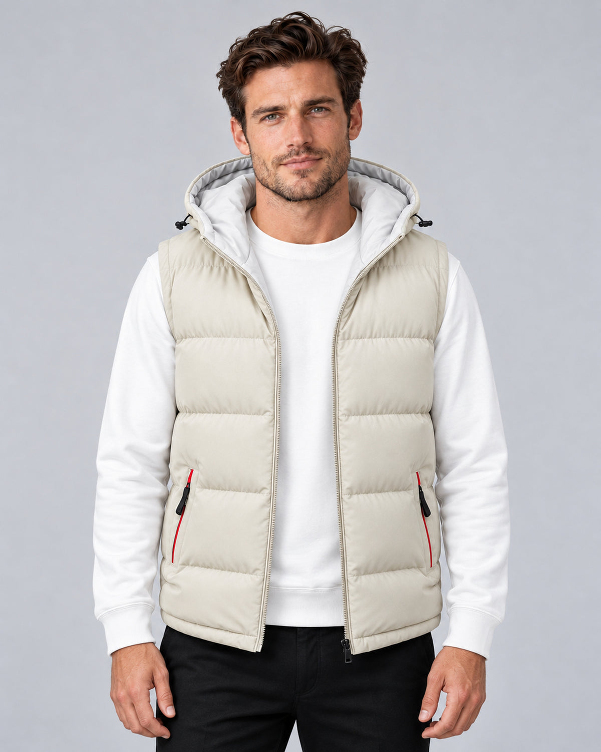 Men's beige hooded padded gilet with horizontal quilting, front view on a model.