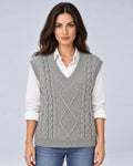 Women's grey cable-knit V-neck sweater vest, front view over a white shirt