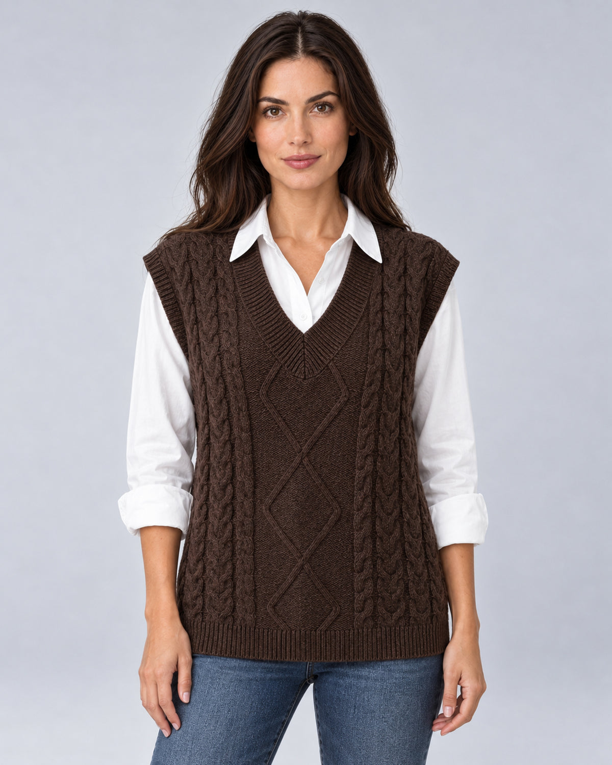 Women's coffee cable-knit V-neck sweater vest, front view over a white shirt