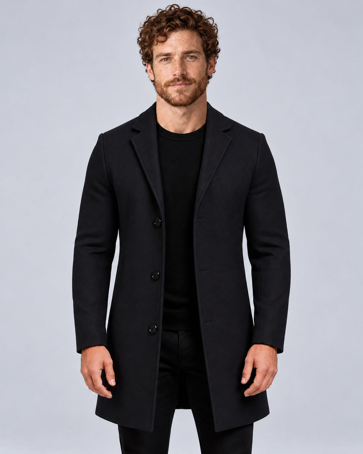 Men’s black tailored overcoat with notch lapels, front view