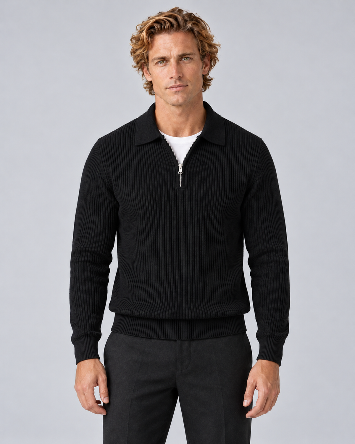Front view of a black textured quarter-zip sweater with a folded collar, ribbed cuffs and hem.