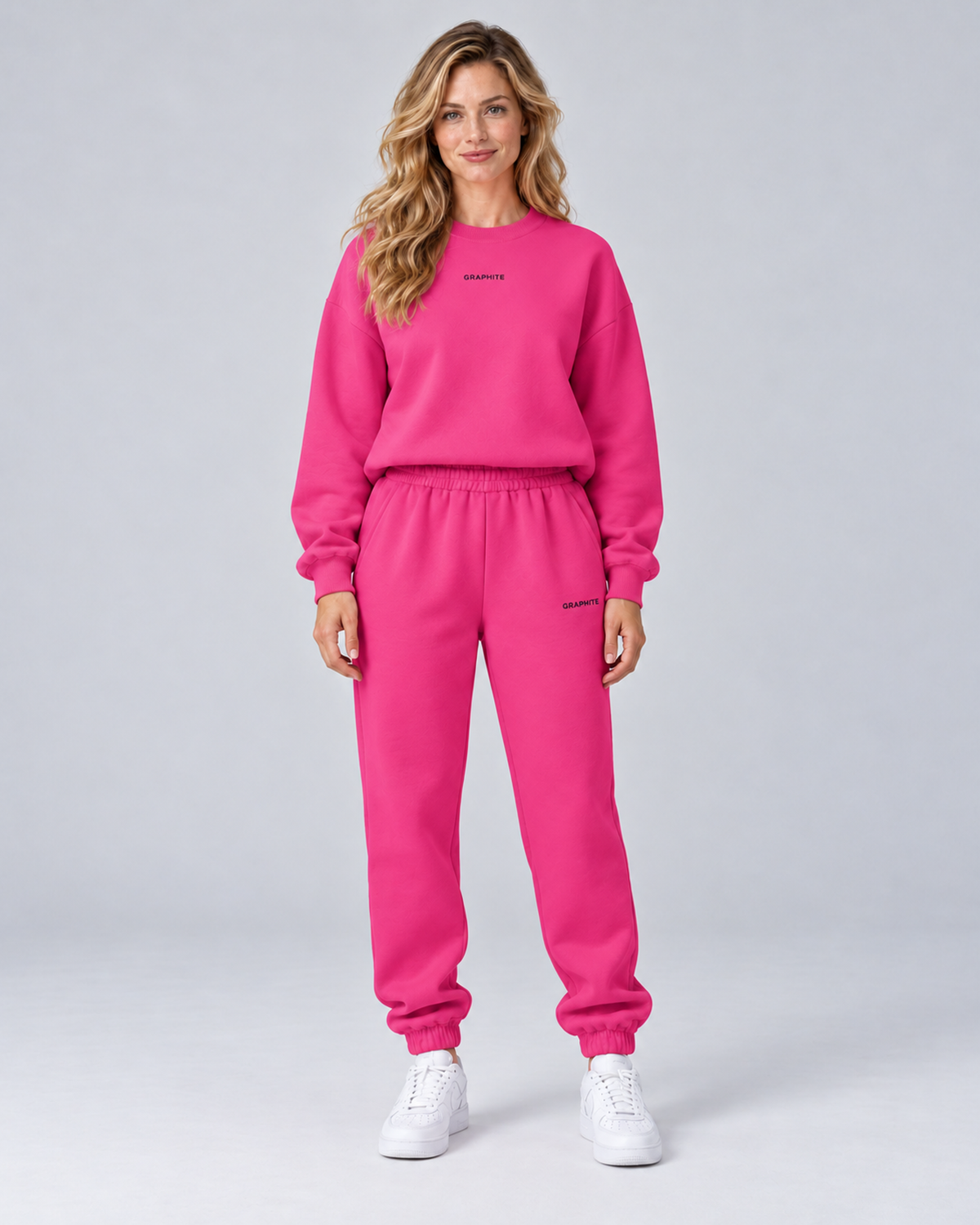 Front view of a red rose crewneck sweatshirt and cuffed joggers set with small embroidered lettering.