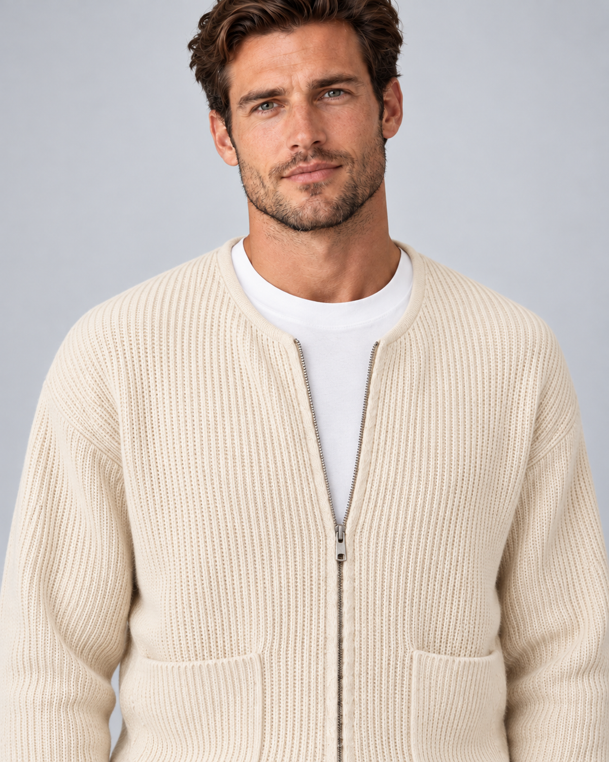 Men's round-neck zip-up rib-knit cardigan in apricot, zipper and knit close-up, on approved studio model