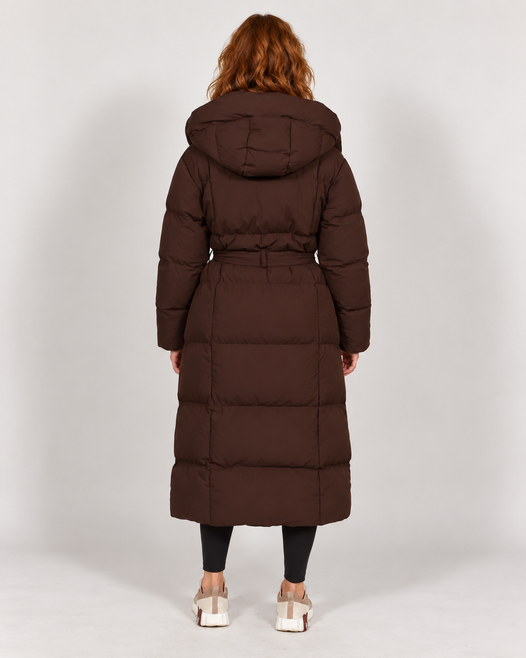Avery & Mercer own model W03 wearing women's long belted puffer coat, brown rear