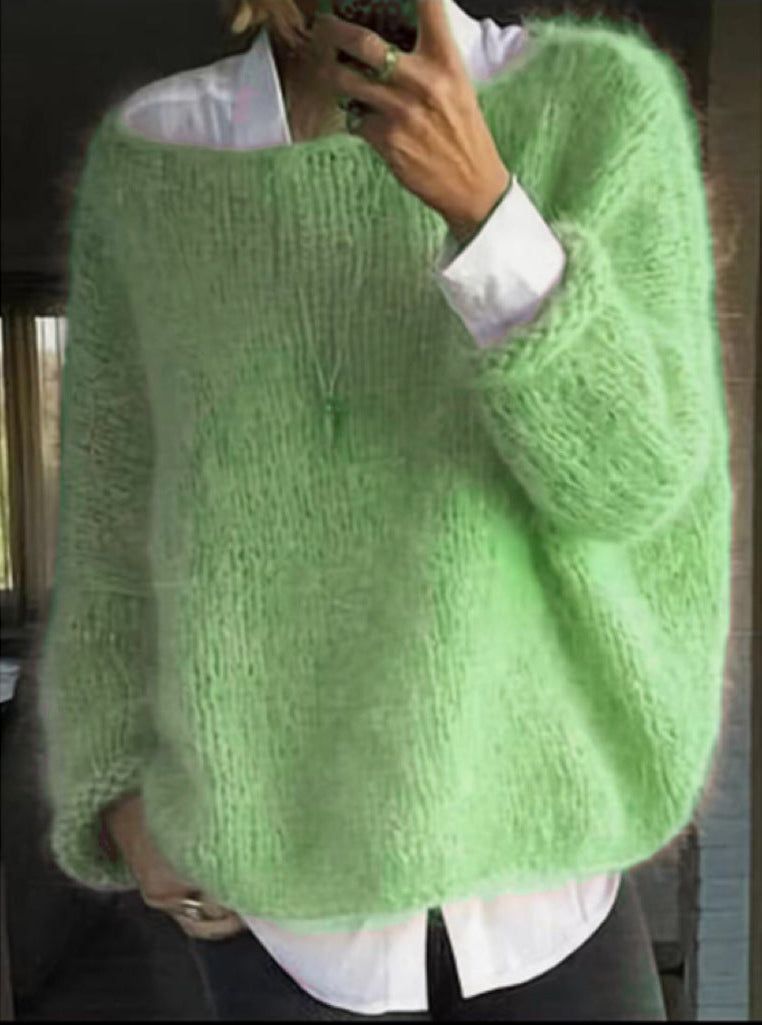 Woman wearing green mohair sweater with wide neckline and long sleeves over white collared shirt